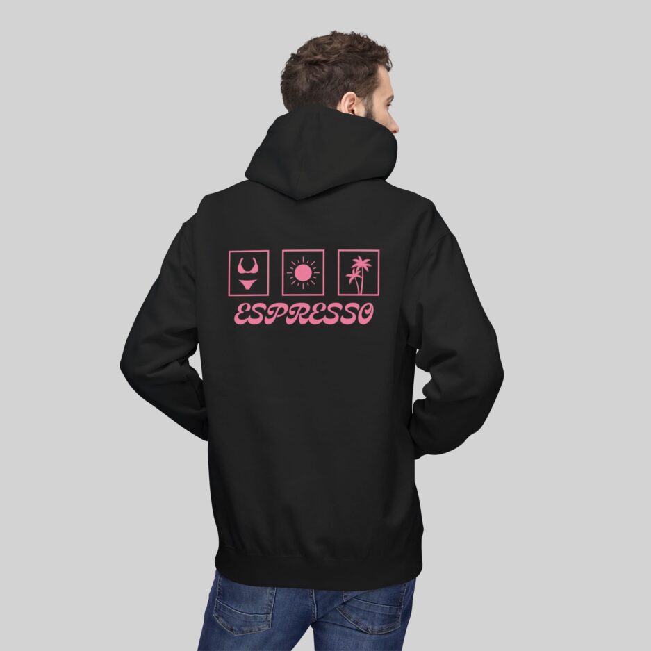 Person wearing a black Sabrina Carpenter Espresso Vibes Hoodie with pink graphics and 'Espresso' text on the back against a gray background