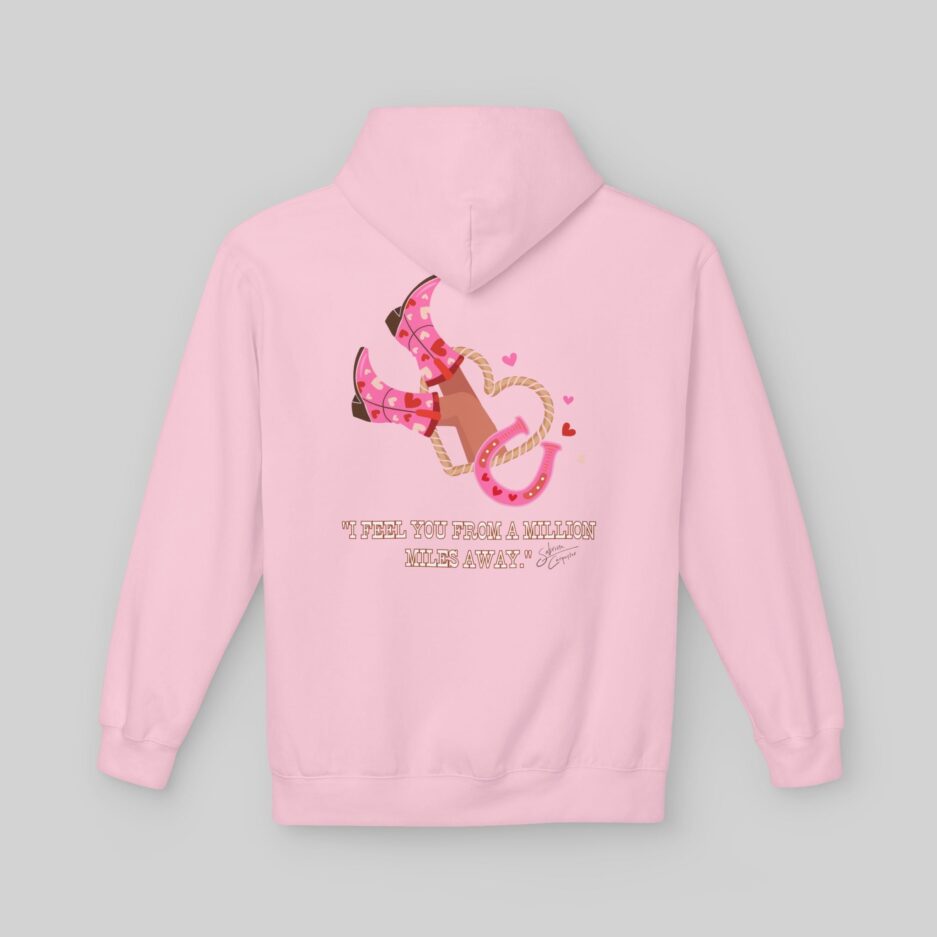 Pink Sabrina Carpenter Love Club Hoodie with cowboy boots and text on the back against a gray background
