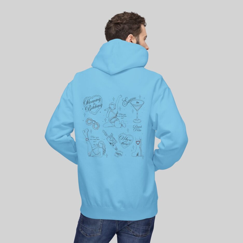 Person wearing a light blue Sabrina Carpenter Short N' Sweet Tour Hoodie with a graphic design on the back against a gray background