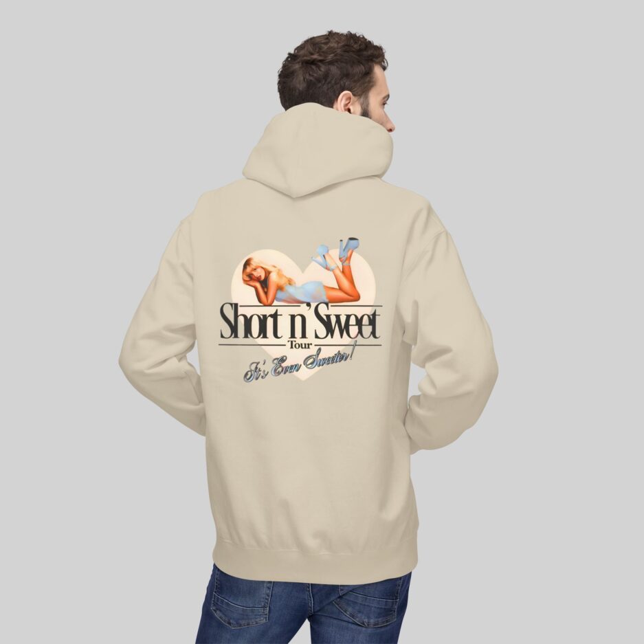 Beige Sabrina Carpenter Short n’ Sweet Hoodie with graphic design and text on the back, worn by a person on a light gray background
